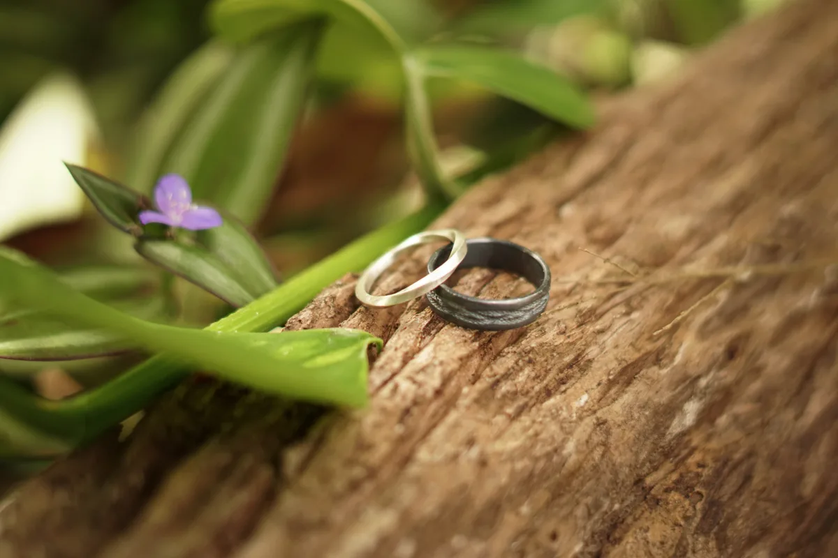 Wedding rings resting on jungle leaves at Casa Arkaana