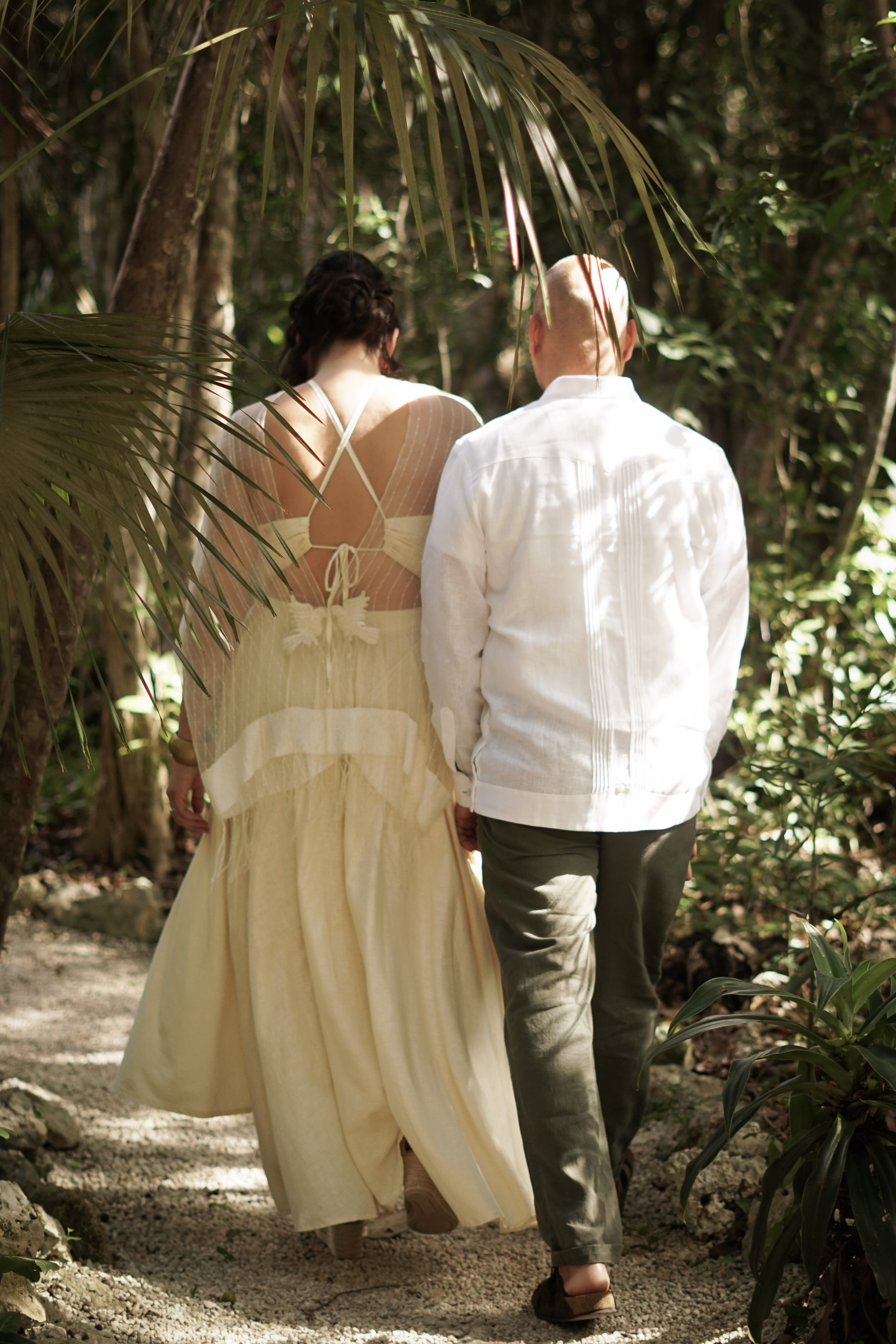 Couple walking through the Mayan jungle at Casa Arkaana