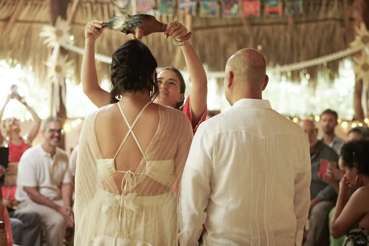 Officiant blessing the couple during their ceremony in the jungle temple