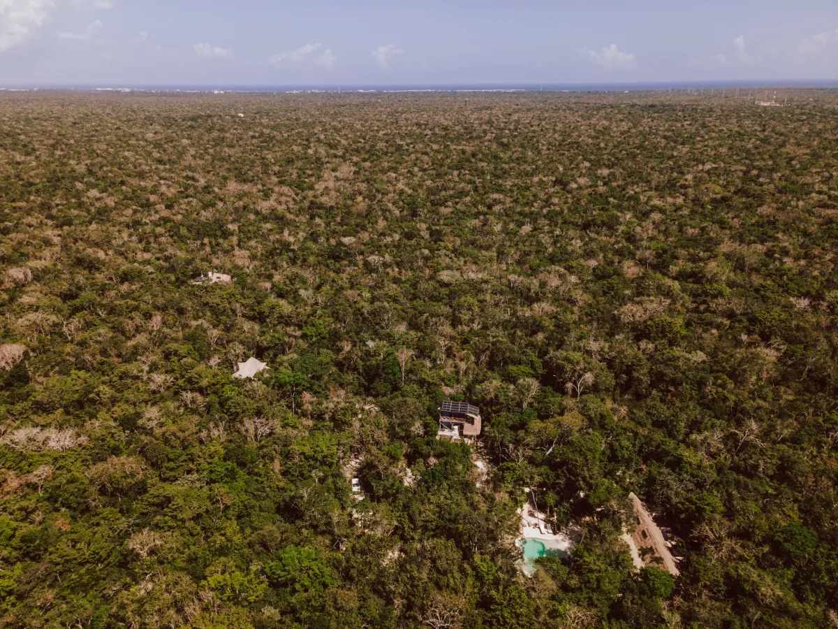 Aerial view of the five-acre Casa Arkaana property surrounded by dense Mayan jungle canopy
