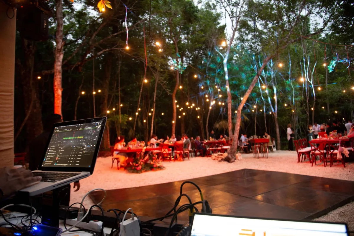 The wooden dance floor under string lights at Casa Arkaana